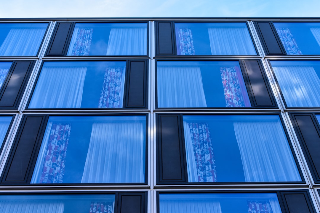 digital modern-building-facade-with-blue-glass-windows-cjnlpkbvcp4